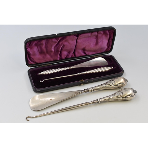 Two Sets of Hallmarked Silver Handled Button Hook/Shoe Horns. Includes Cased Pair of Hallmarked Adie & Lovekin Ltd Birmingham Silver Handled, And Pair of Hallmarked Crisford & Norris Ltd Birmingham Silver (Circa 1907)