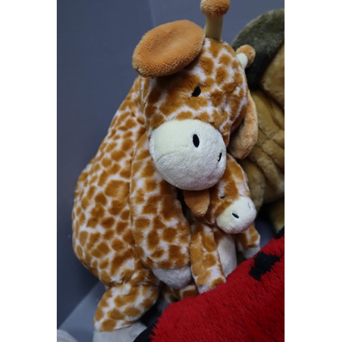 749 - A Selection of Five Soft Toys To Include Disney Tsum Tsum, Pug, Giraffe, And More