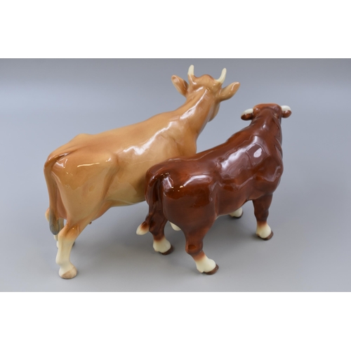 315 - Two Ceramic Cow Figures To Include Melba Ware Jersey Cow and Leonardo Hereford Bull. Largest Approx ... 