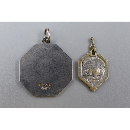 106 - Vintage Hexagonal Silver St Christopher Pendant together with an unmarked enamalled pendant