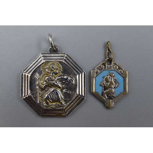 106 - Vintage Hexagonal Silver St Christopher Pendant together with an unmarked enamalled pendant