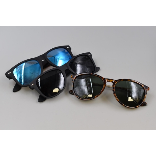 450 - Two pairs (2 in one box) of mens polarized sun glasses with blue and black lenses, brand new and box... 