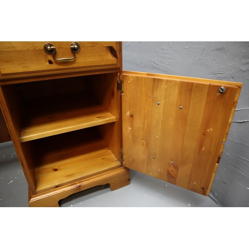 620 - Large pine desk with three large drawers, one small centre drawer and a cupboard with shelf and chai... 