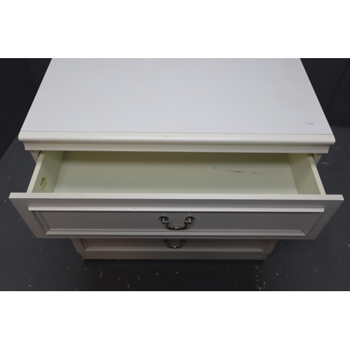 614 - White three darwer chest with silver handles on castors measures 29