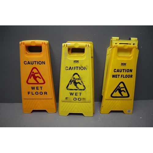 655 - Seven wet floor/hazard signs