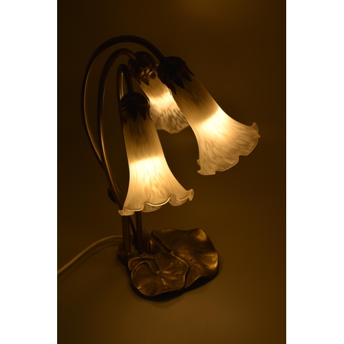 301 - Tiffany style lily pad table lamp with 3 white frosted art glass tulip shades. Approx 15.5