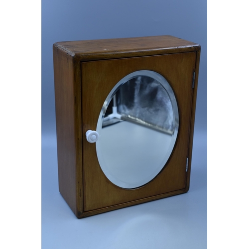 310 - A Vintage Oak Wall Hanging Medicine Cabinet, With Bevel Edged Mirror Front and Glass Shelf. Approx 5... 