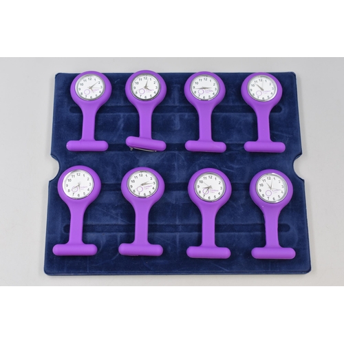 119 - Eight Rubberised Purple Nurse's Watches