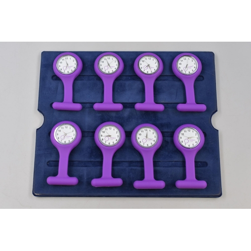 122 - Eight Rubberised Purple Nurse's Watches