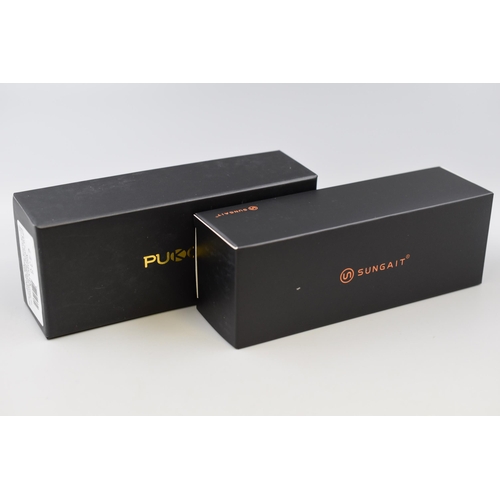 394 - Two Pairs of Brand New Boxed Designer Sunglasses to include Pukclar and Sungait