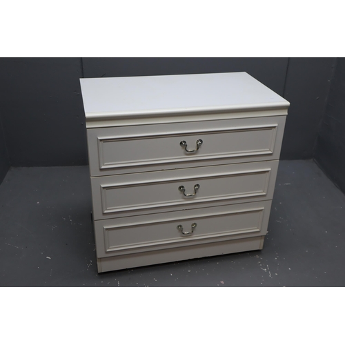 570 - White three Drawer chest with silver handles on castors measures 29