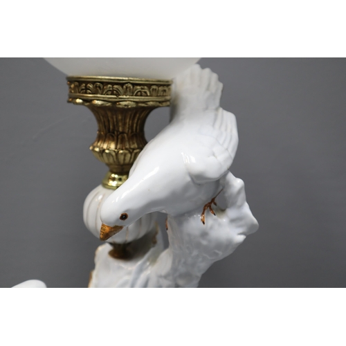 297 - Large Italian ceramic lamp in white with three birds and glass shade measures 23