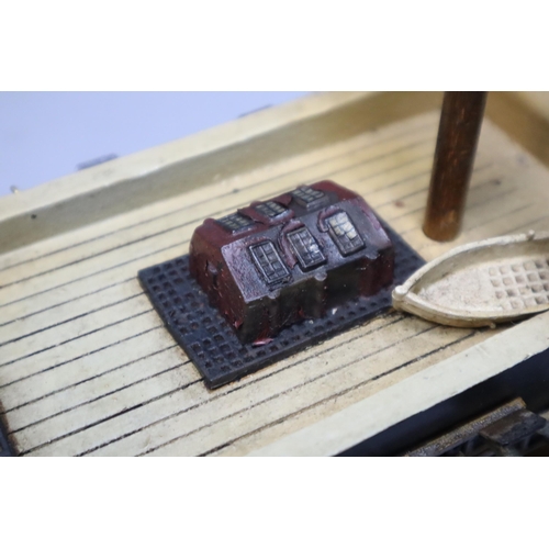 321 - Scale wooden model of a 16th centuary Spanish frigate on a wooden plinth, measures 28