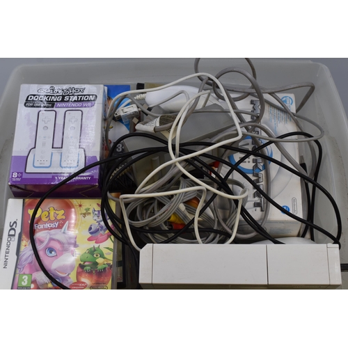 555 - Nintendo Wii (powers on not tested) with two games (boxed) and wii fit (unboxed) and a Mario kart st... 