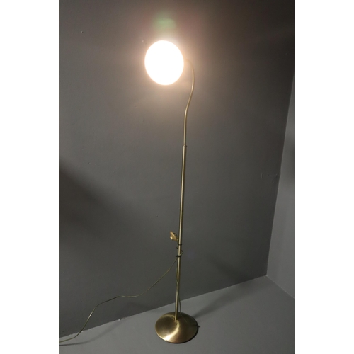 559 - Brass effect standard/reading lamp with foot switch measures 61