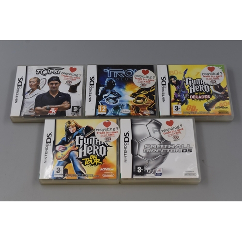 172 - Nintendo DS Gaming Console (Powers On / No Lead) complete with 5 Boxed Games