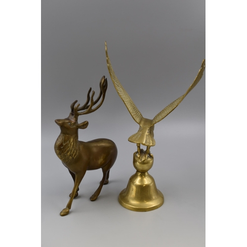 225 - A brass eagle on a stand measures 13