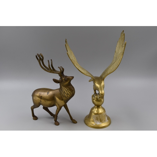 225 - A brass eagle on a stand measures 13