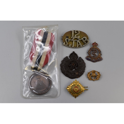 243 - A Selection of Military Badges and Medals. Includes Bakelite Royal Engineers Badge, Royal Army Medic... 