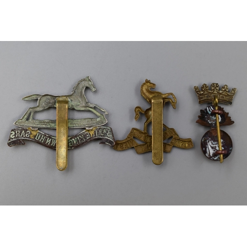 245 - Three Military Badges including Queens Own Royal west Kent, a Royal Irish Fusilier's, and a 3rd King... 