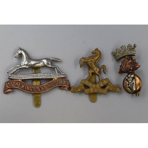 245 - Three Military Badges including Queens Own Royal west Kent, a Royal Irish Fusilier's, and a 3rd King... 