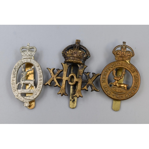 248 - Three Military Badges including Hertfordshire Regiment, Hertfordshire Yeomanry, and a 20th Hussars