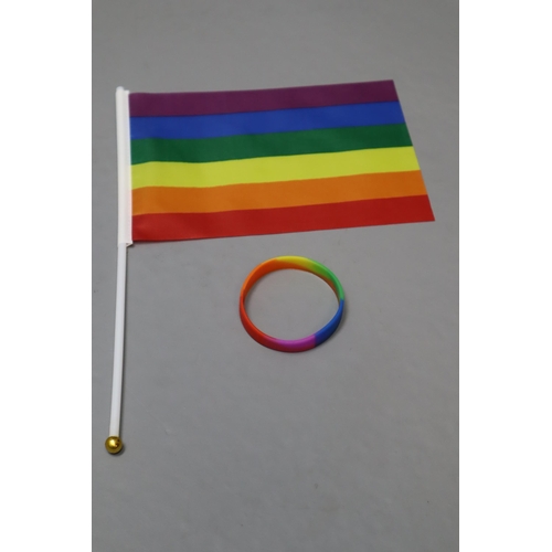 699 - Seven Packs of Gay Pride Decorations. Each Pack Includes Ten Wrist Bands, One Flag, And Ten Flag Sti... 