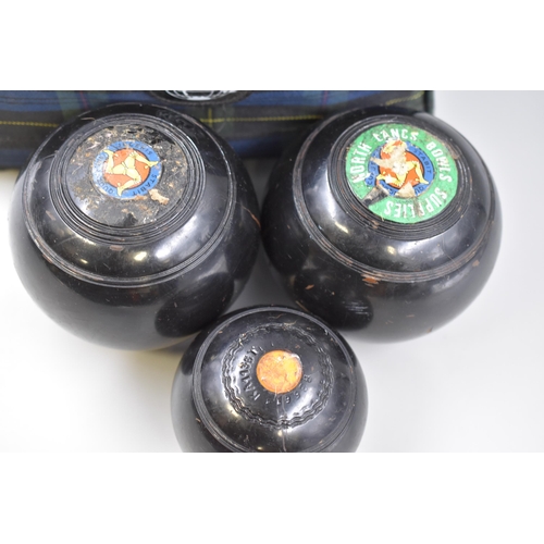 645 - Set of Bias 2 lawn bowls with jack in a Kelly's lawn bowls carry bag