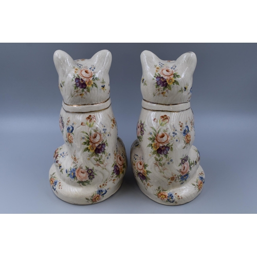 266 - A pair of ceramic cats with flower design and green glass eyes 12