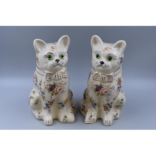 266 - A pair of ceramic cats with flower design and green glass eyes 12