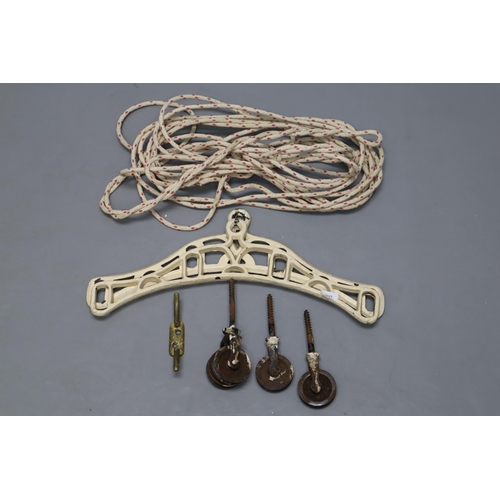 663 - An Antique Creel Clother Airer Set. Includes Cast Iron Ends and Pulley System. No Wooden Slats