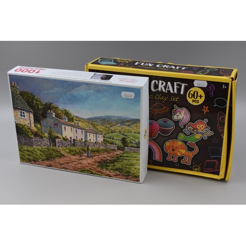 717 - Two Boxed Items to include a 1000 Piece Jigsaw Puzzle and a Fun Craft Magic Clay Set both unchecked ... 