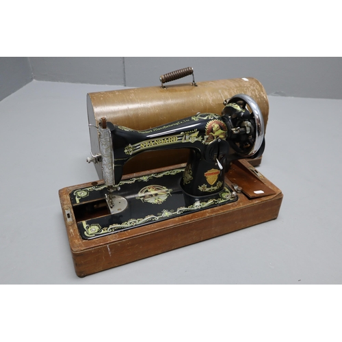 743 - 50+ year old vintage Standard sewing machine. Some Wear and Tear and cased.