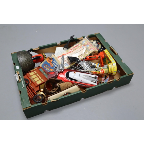 727 - A Box of Vintage Children's Toys To Include Tin Plate Elephant, Toy Cowboy Revolvers, Space Rocket, ... 