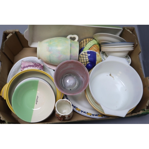 767 - Large selection of mixed pottery and ceramics to include plates, bowls mugs, vases, mixing bowls and... 