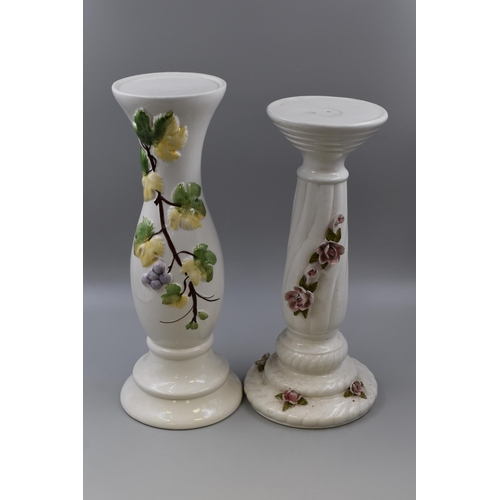 two ceramic plant stands one with grape vine design 17" high x 6" diameter and one with rose design 16" high x 7" wide