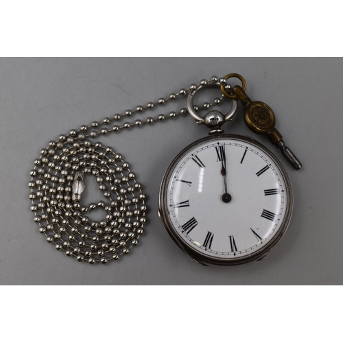 127 - Hallmarked Birmingham Silver key Wound Pocket Watch complete with Key and Chain