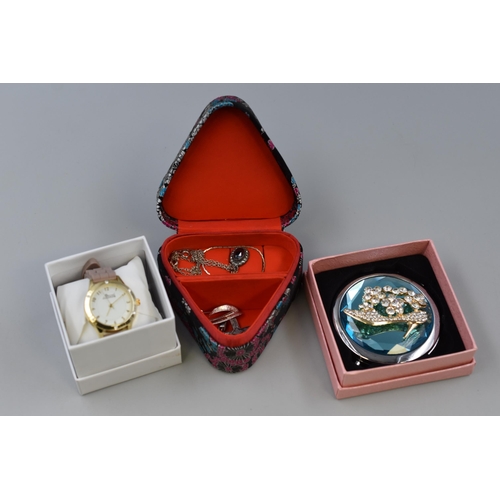140 - Women's watch by Secret Dream with crystal inlays on the face, plus a ladys compact makeup mirror wi... 