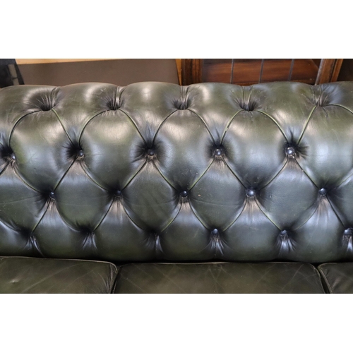 660 - Button Back Green Leather Chesterfield Three Seater Settee in good usable condition approx has integ... 