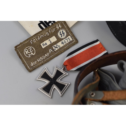 240 - A Selection of Replica German WWII Accessories To Include Two Belts, Replica Iron Cross, Military Ha... 