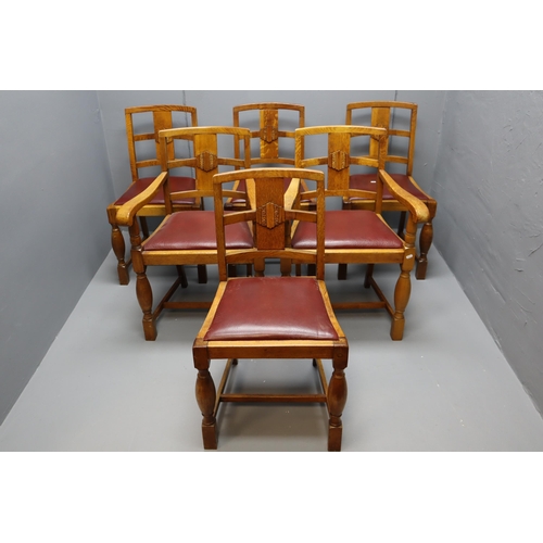 674 - Set of 6 Golden Oak Red Leather Upholstered Dining Chairs. Incl 2 Carvers. ( possibly faux leather)