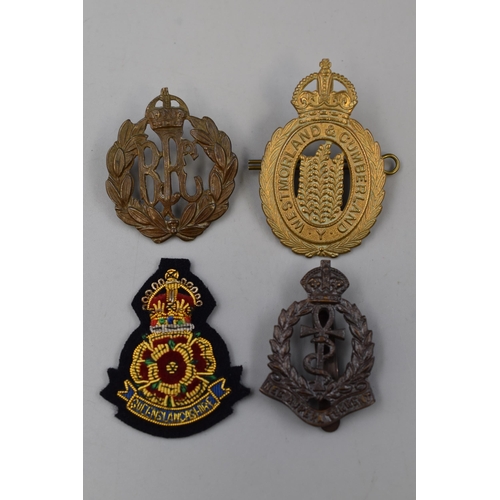 275 - Four Military Badges including Westmorland & Cumberland, Royal Army Medical Core, Royal Flying C... 