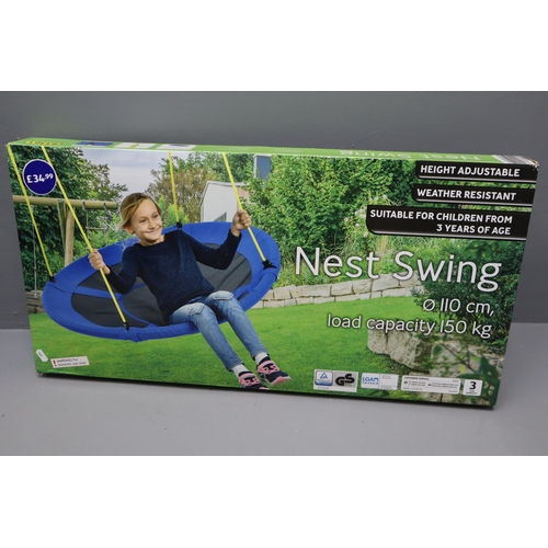 818 - An Outdoor Lot including: A practice cage net and A Nest swing. Both in original boxes and both chec... 