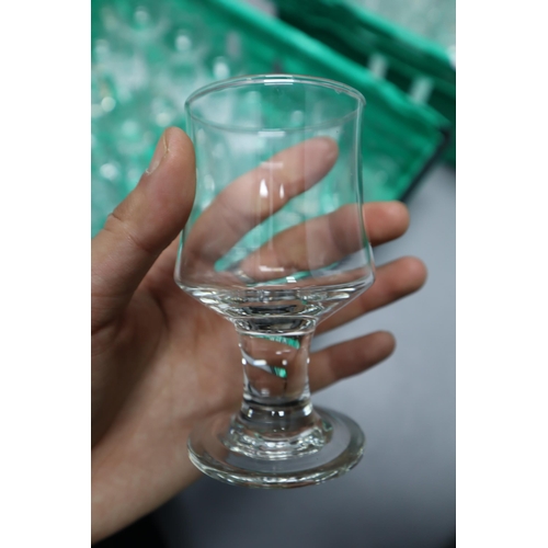 859 - Large mixed selection of glasses to include flutes, beer glasses shot glsses, fruit juice and wine g... 