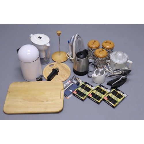 835 - Selection of kitchenalia to include iron, wooden chopping board, William Morris tea, coffee, sugar c... 