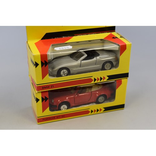 556 - Four Shell classic sportscar collection models. BMW Z1, Ferrari 288 GTO, Porsche 911 SC, Jaguar E Ca... 