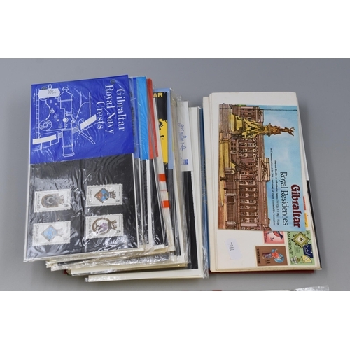 477 - A selection of Mint stamp covers, Three Collections of Gibraltar stamps with Coins and a Collection ... 