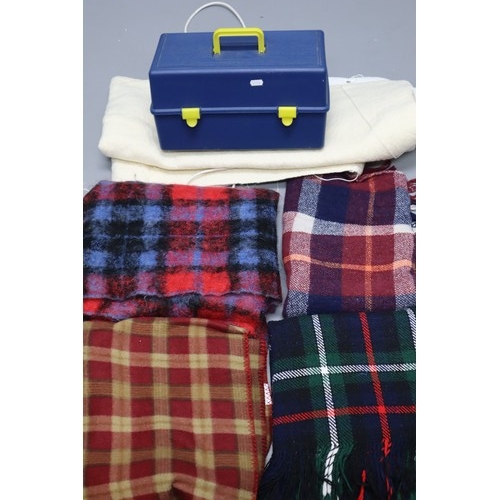 869 - Four tartan travel rugs and a single electric blanket (working) and a sewing box containing sewing i... 