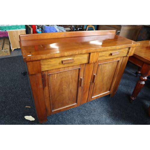 Vintage 2 drawer dark wood sideboard with 2 cupboards and internal ice box measures 47" wide x 15.5" deep x 34" high.