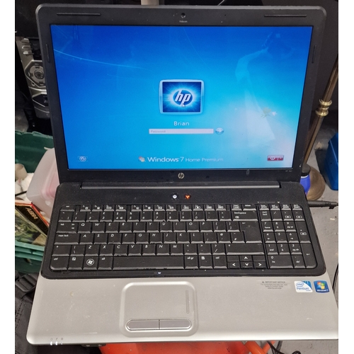 HP Laptop. With Power Supply. House Clearance item powers on. Windows.